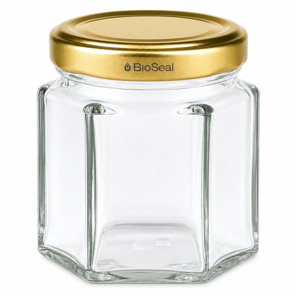 Honingpot 60 g met gouden BioSeal UNiTWIST-deksel 60g zeshoekig honingpotje met gouden schroefdeksel BioSeal UNiTWIST voor honing en jam