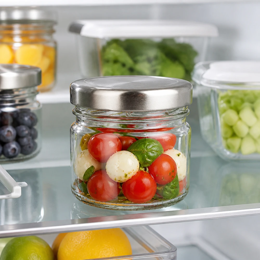 33 ml rond glas + BasicSeal-deksel zilver UNiTWIST Glazen pot van 33 ml met luchtdichte BasicSeal-deksel (zilver) voor portieverpakte snacks en bijgerechten