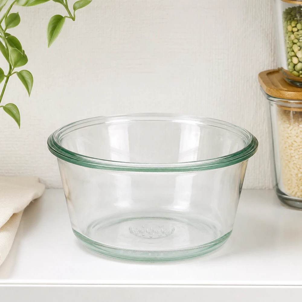 290ml gourmetglas WECK RR100 WECK RR100 290ml gourmetpot leeg op wit keukenblad naast voorraadpotten en groene plant